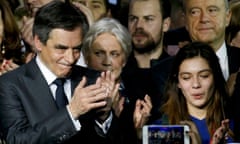 François Fillon (left) with his wife Penelope (second left) and Alain Juppe (top right) at a political rally in Paris on 29 January.