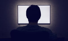 Man in front of a blank monitor<br>Man sits in front of a blank monitor in dark room