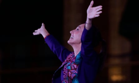 Mexican President-elect Claudia Sheinbaum raises her arms in celebration