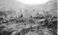 Rescue workers forming a chain to move debris, in an effort to reach children trapped in Pantglas Junior School, at Aberfan, near Merthyr Tydfil, Glamorgan, after it was engulfed by a sliding mountain of slag.