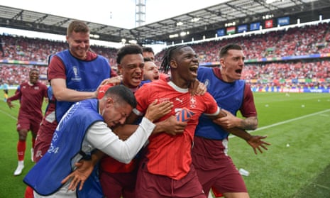 Switzerland’s Breel Embolo celebrates with teammates after scoring their third goal against Hungary.