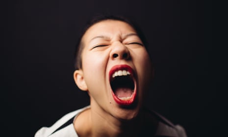 A woman in black and white, screaming at the top of her voice