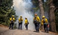 California lighting sparked wildfire and evacuations<br>epa08621105 Fire fighters keeps an eye on a back fire they set to burn off fuel near a home in Ben Lomond, California, USA, 23 August 2020, as the CZU Lightning Complex fire continues to burn well into its 7 day with more than 67,000 acres burned, 115 structures destroyed, 5% containment and approximately 70,000 people evacuated across two counties on 23 August. EPA/PETER DASILVA