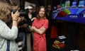 Party leader Li Andersson, wearing a red dress, and with folded arms, greets the media with a  smile after her success at the end of the Left Alliance's European parliament election reception in Helsinki, Finland, on 9 June