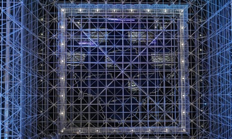 An outline of the US-shaped stage is reflected in the ceiling at the Javits center.