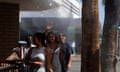 People walk under water misters in Palm Springs, California.