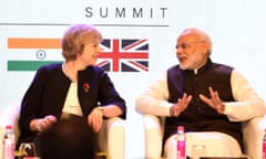 Britain’s Prime Minister Theresa May(L) speaks with India’s Prime Minister Narendra Modi as they attend The India-UK Tech Summit in New Delhi on November 7, 2016. Prime Minister Theresa May said Britain would become the ultimate free trade champion as she laid the groundwork for a potential post-Brexit deal with India, the world’s fastest growing major economy.