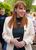 Angela Rayner campaigns in Darlington: she is pictured with her long red hair worn loose and is wearing a black top under a pale cream jacket plus a necklace with red lettering that reads Vote Labour. 