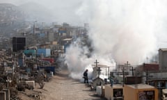 A healthcare worker sprays fumigation vapour to stem the spread of dengue virus in Lima in June 2022.