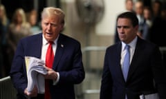 a man in a blue suit and red tie flips through a stack of papers