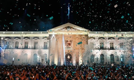 El Salvador president Nayib Bukele, accompanied by his wife, Gabriela Rodriguez, addresses supporters from the balcony of the presidential palace in San Salvador, El Salvador, after polls closed on 4 February