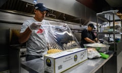 US-IMMIGRATION-VENEZUELA-LATAM-ELECTION<br>Gustavo Mendez poses prepares food at the restaurant where he works, in the Queens borough of New York City, on October 18, 2022. - The American dream is materializing for Venezuelan Mendez, who arrived in New York, a sanctuary for immigration, two months ago. "If you can dream it, you can have it," he says by way of a declaration of intent in his Whatsapp status. (Photo by Ed JONES / AFP) (Photo by ED JONES/AFP via Getty Images)