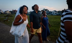 On tony Martha's Vineyard, a center of Black political power grows<br>Martha's Vineyard, MA - September 9: Alicia Criner Mayo, left, and Justyn Mayo walk to dinner with family, hours after getting married in Oak Bluffs. The pair met during the pandemic on Inkwell Beach and were married by the groom's grandfather, Royal L. Bolling Jr., who served in the Massachusetts House of Representatives. Mayo's family has been coming to Oak Bluffs for three generations. (Photo by Erin Clark/The Boston Globe via Getty Images)