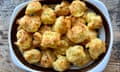 Topview of a ceramic dish filled with cheese gougères aka French cheese puffs.