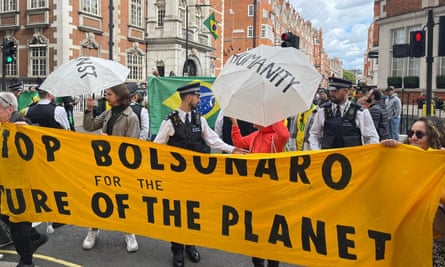 Protesters gather outside the ambassador’s residence in Mayfair