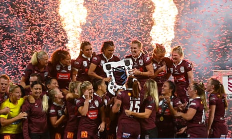 Ali Brigginshaw and her Queensland teammates celebrate with the Women’s State of Origin trophy