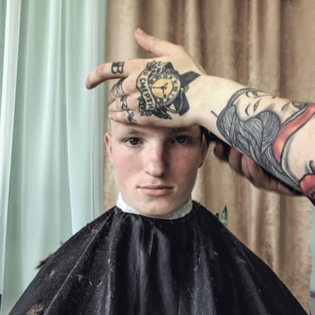 Haircut of 18-year-old, before his release from an orphanage in Idritsa.