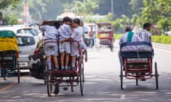 Boys on their way to school in Delhi.