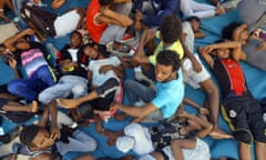 Migrants in the Ganzour shelter after being transferred due to fighting in the Libyan capital Tripoli