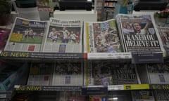 Newspapers are displayed for sale in a supermarket