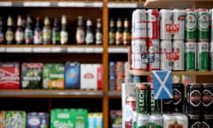 Alcohol for sale in a supermarket with a Scottish flag attached to one shelf