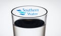 The logo of water company Southern Water seen through a glass of water