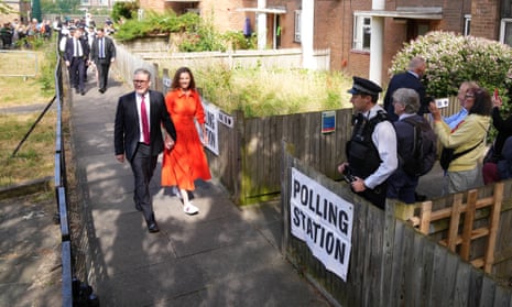 Keir Starmer and his wife Victoria Starmer head to their local polling station.