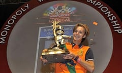 Bjørn Halvard Knappskog holds a trophy after winning the Monopoly World Championships in Las Vegas.