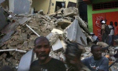 This Twitter image shows Haitians standing amid the rubble in Port-au-Prince