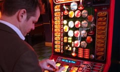 A man at a slot machine