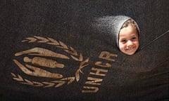 A Syrian refugee girl at the Al Za'atri refugee camp in the Jordanian city of Mafraq