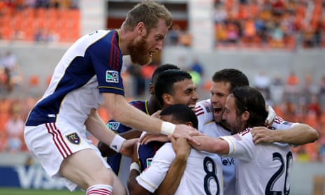 Real Salt Lake's Javier Morales is mobbed by teammates after scoring against the Houston Dynamo. How many RSL players will be going to the World Cup?