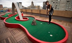 A Google employee putting on the roof of the company's Toronto office.