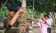 Child helping to make the METI handmade school in Bangladesh.