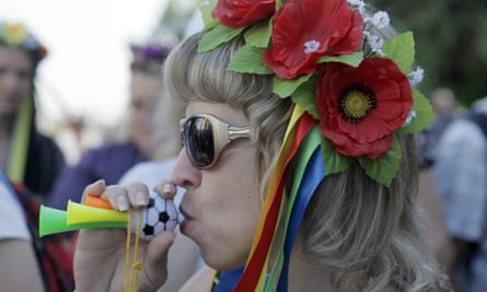 A protester in Kiev at a rally to demand government protection over the rapid depreciation of the currency.