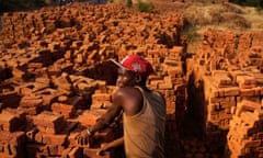 A worker stacks bricks in Kabezi, Burundi, Africa.