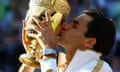 Roger Federer of Switzerland kisses his trophy after beating Andy Roddick in the Wimbledon final