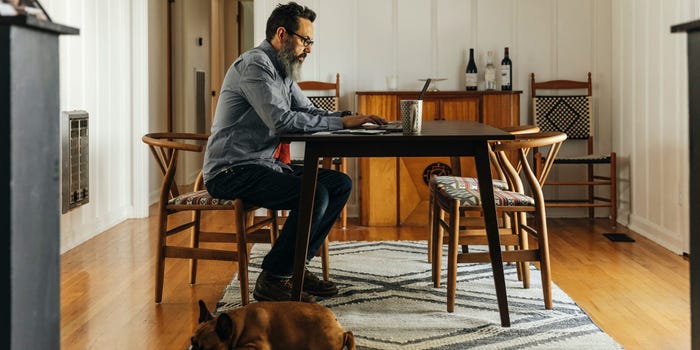 man working on laptop at home