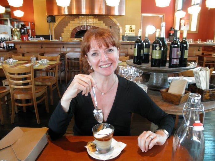 a woman eats a dessert in a wine shop