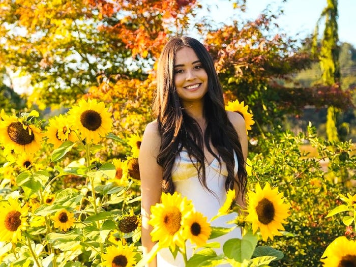 Woman in sunflower field