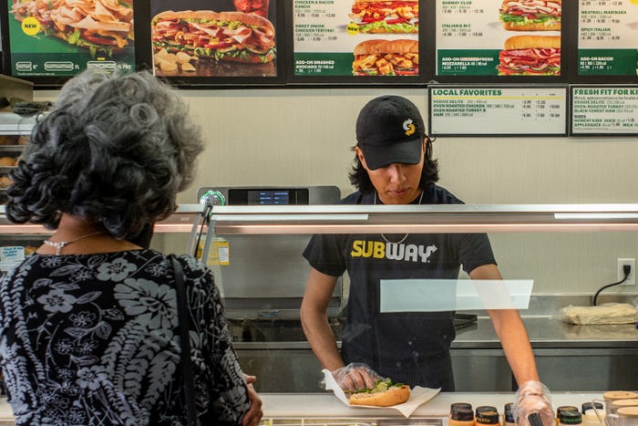 A customer orders food at a Subway fast-food restaurant on April 29, 2022 in Houston, Texas.