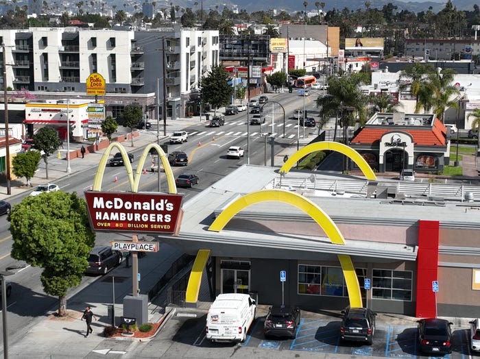 An aerial view of fast food restaurants on Crenshaw Blvd including Taco Bell, McDonald's, Yoshinoya, Subway, El Pollo Loco, Little Caesers, Panda Express,Taco Bell, and Smart & Final grocery store. Photo taken in south Los Angeles Friday, March 29, 2024.