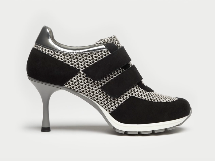 A black and silver Sneex shoe.