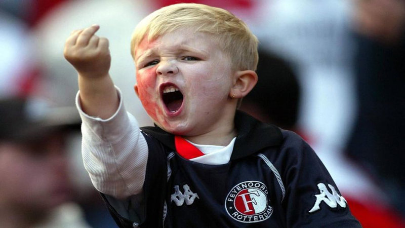 Middle Finger Kid showing a young soccer fan named Mikey Wilson flipping off the camera at a match.