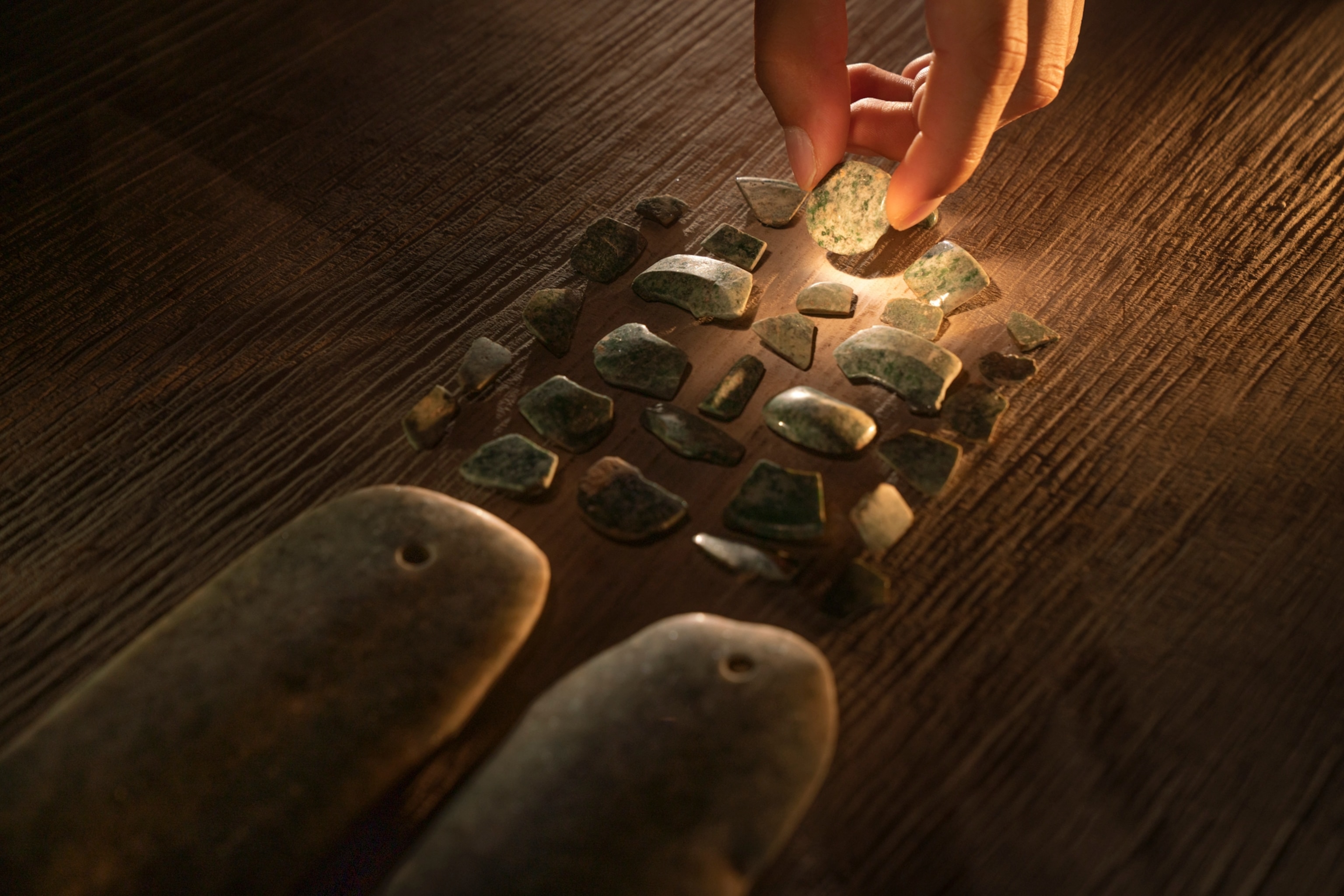 Mayan jade pieces being assembled