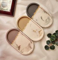 This decorative jesmonite trays are not only artistic but also practical. Jesmonite products are composite materials, a combination of a reactive mineral base and a pure water based acrylic resin, non-solvent and contain zero VOCs. It is Eco-friendly and has unlimited ways to utilize. The tray and a round holder are a set.