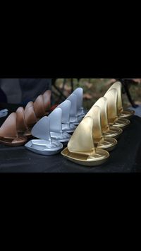 Rain gutter regatta trophies