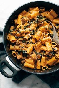 AMAZING rigatoni with sausage, kale, tomato cream sauce, Parmesan, and red pepper flakes! Perfect for date night! | pinchofyum.com