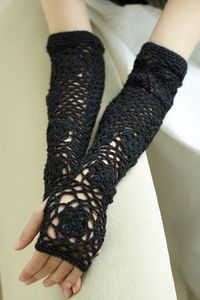 The Opera Sleeves Pattern is a crochet accessory pattern made with fine weight yarn that has a skill level of expert.