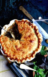 Southern squirrel pot pie with a slice removed, recipe by Stacy Lyn Harris from her Harvest Cookbook